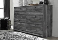 Beachy style and lots of storage go hand in hand with the Baystorm dresser. Its driftwood and surfer-inspired smokey finish creates a rustic look that's perfect for setting the scene of an island getaway. Six roomy drawers give you the space needed for stowing away clothes and more. Clean lines and modern handles provide an authentic look to be admired for years to come. Queen Mattress Set, Grey Dresser, Rustic Coastal, Beachy Style, Queen Panel Beds, Ashley Furniture Homestore, Mattress Frame, Home Theater Seating, Furniture Warehouse