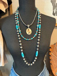 Expertly crafted, the Culpepper Rosary Necklace combines faux silver and faux turquoise beads for a stunning western fashion accessory. With no clasp, it can be worn long for a dramatic look or layered for a trendy stacked look. Versatile and stylish, it's perfect for any outfit. Styled with Carson and Cowgirl Necklace with Preston Earrings 34" long Cowgirl Necklace, Cowgirl Necklaces, Tassel Necklace Boho, Layered Sweater, Rosary Necklace, Silver Jewelry Fashion, Dramatic Look, Western Jewelry, Denim Leggings