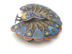 Figural Jewelry - This is a gold washed sterling silver cannetille peacock brooch / pin. It is brightly enameled with blue green, yellow and red and measures 1.75" and 2". The brooch weighs 11.8 grams and has no markings. Peacock Brooch, Figural Jewelry, Pins Brooch, Antique Modern, Bird Brooch, Bird Jewelry, Gold Wash, Brooch Vintage, Stamp Making