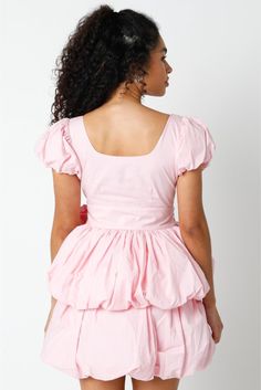 Bubbly sleeves playfully frame a square-neck mini dress cut with a flared layered bubble skirt and covered in vintage pink florals. • Puff Short Sleeves• Square Neck Line• Layered Skirt• Tie Waist• Side Zipper• Lined