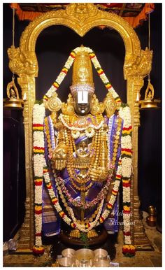 the statue is decorated with gold and jewels