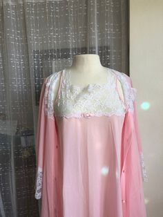 Vintage Pink Nightgown// Peignoir Set//Size M//Miss Elaine//MINT//Pink Babydoll nightgown//Robe//Union Made in the USA Simply DARLING! MINT, never worn, the Miss Elaine and the union tag are crisp and new. Like wearing a pink cloud trimmed in white cloud lace! Seen here on a size 8 dress form. Nylon. Covered buttons. Lave to the hem of both pieces. Armpit to same: 40 Length: 40 ( right above the knees) Sweep: 104 Very Betty Draper. From a time when this country had union garment workers and a st Pink Long Sleeve Set With Lace Trim, Pink Long Sleeve Sets With Lace Trim, Pink Lace Trim Long Sleeve Set, Pink Feminine Sleepwear Sets, Pink Feminine Sleep Sets, Pink Long Sleeve Nightgown For Wedding Night, Pink Feminine Robe For Sleepover, Pink Lace Trim Pajama Party Sets, Feminine Pink Sleep Chemise