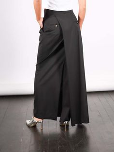 Made from wool suiting fabric this maxi skirt has a deconstructed design that blends pant tailoring with drapery along a pencil skirt silhouette.    model cheyenne is 5'7" and a size xs wearing the size 38.    care 2  professional dry clean with a trusted dry cleaner only.    color  black    details 2  98% virgin wool | 2% elastane    fit 2  designed with a slim fit at the waist and hips and with a loose fit at the legs.  euro to us sizing 38 - 4 40 - 6 42 - 8 44 - 10 46 - 12 Pant Skirt, Suiting Fabric, Dry Cleaners, Black Suits, Skirt Pants, A K, Long Skirt, Vintage Dresses, Black Color