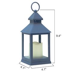 a blue lantern with a white candle inside and measurements for the top part of it