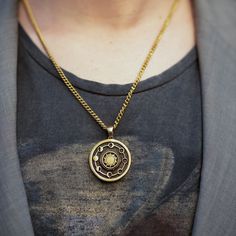 This is a Moon necklace, a handmade jewelry. This unisex necklace is the perfect gift for him and her any time of the year  Immerse yourself in the magic of the moon phases with this beautiful handmade necklace. Every detail of this piece is designed to honor the energy and transformative power of the moon. The Moon Phases necklace will connect you with the essence of the moon and remind you of the constant renewal and change we experience in our lives. Each lunar phase represents a unique stage, from the darkness and introspection of the New Moon to the fullness and manifestation of our dreams in the Full Moon. Choose the material of the pendant that resonates with you, whether it's silver, bronze, or any other material of your choice. You will also have the option to select the chain mat Moon Phase Coin Necklace With Round Pendant, Amulet Style Necklace With Moon Charm In Brass, Spiritual Moon Phase Round Pendant Necklace, Brass Amulet Necklace With Moon Charm, Brass Amulet Medallion Necklace As Gift, Moon Phase Medallion Necklace In Amulet Style, Moon Phase Medallion Necklaces Styled As Amulets, Moon Phase Medallion Amulet Jewelry, Brass Coin Necklace With Adjustable Chain As Gift