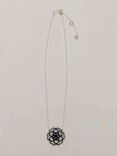 With a touch of silver and a splash of architectural lightness, this necklace with 3D printed geometric flower pendant adds just the right wink of uniqueness to any look! This pendant necklace is printed with TPU filament, a flexible plastic, and printed on an Anet AM8 3D printer. This lightweight piece weighs in at less than a quarter of an ounce, so nothing heavy to drag you down! Each pendant necklace is printed and assembled with care in Saratoga Springs, NY, and is ready to ship in 3-5 busi Geometric Black Necklace For Gift, Black Hexagon Necklace For Gift, Silver Geometric Metal Necklace, Black Geometric Necklace For Gift, Geometric Silver Necklace For Gift, Silver Hexagon Necklace For Jewelry Making, Silver Geometric Necklace For Gift, Black Pendant Necklace, Mod Jewelry