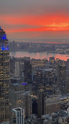 an aerial view of new york city at sunset