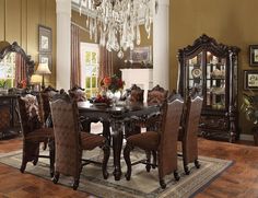 a dining room table with chairs and a chandelier