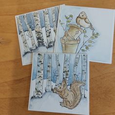 three cards with squirrels and birch trees on them, one is holding a bird