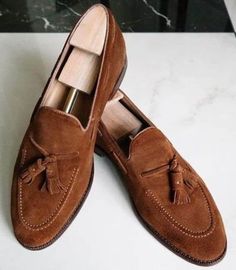 Brilliant craftsmanship is reflected in these handcrafted luxurious brown tussle loafers. Take every step with confidence as meticulously executed stitches ensure durability and elegance. we take pride in the timeless style and unparalleled craftsmanship of our shoes. Brown Leather Shoes With Tassels And Round Toe, Brown Slip-on Moccasins With Tassels, Formal Brown Dress Shoes With Tassels, Luxury Brown Tassel Loafers For Semi-formal, Luxury Brown Tassel Loafers For Semi-formal Occasions, Luxury Brown Tassel Loafers For Business, Brown Wingtip Loafers With Tassels, Brown Oxfords With Tassels And Round Toe, Luxury Brown Tassel Loafers With Goodyear Welted