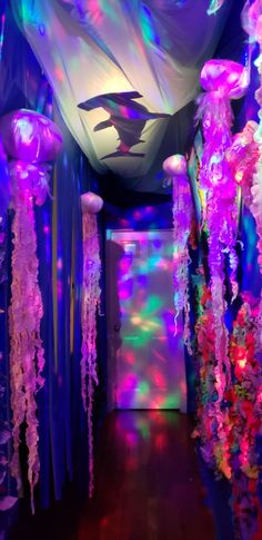 the hallway is decorated with jellyfish and lights