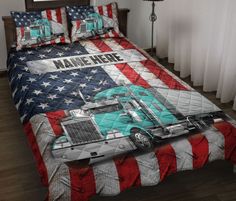 a bed with an american flag quilt and matching comforter set that has a semi truck on it