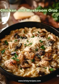 chicken and mushroom pasta in a skillet with parmesan cheese on the side