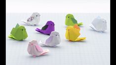 several origami birds sitting on top of each other