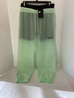 Nike Sportswear Women's Woven Pants Cucumber Calm/Black M NWT $90 (CJ3006-318). Condition is "New with tags". Shipped with USPS Priority Mail. Full Length Nylon Sports Pants, Green Nylon Sportswear Activewear, Green Stretch Functional Pants, Functional Stretch Green Pants, Moisture-wicking Full-length Nylon Bottoms, Moisture-wicking Nylon Full Length Pants, Nylon Sportswear Bottoms For Gym, Sporty Green Gym Bottoms, Green Gym Sportswear Bottoms