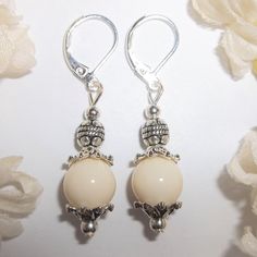 You Will Love The Neutral Color Of This Beaded Earring Set. Brand New & Hand Made By Me - Wvluckygirl. Done With Cream Beige Acrylic Beads And Antiqued Silver Toned Costume Jewelry Beads. The Pair Dangle & Drop From 925 Sterling Silver Lever Backs For Women's Pierced Ears. 1 5/8 Inches Tall & 3/8 Inch Wide. Each Single Earring Weighs 2.0 Grams. Lightweight! Would Make A Fabulous Gift Idea For Her! Fashion Accessory Dangly Dangling Elegant Sophisticated Timeless Classy Classic Piece Everyday Nwt Cream Round Beads Earrings As A Gift, Nickel-free Cream Dangle Jewelry, Elegant Silver Teardrop Beaded Earrings, Cream Dangle Earrings Nickel Free, Nickel-free Elegant Beaded Earrings, Nickel Free Cream Dangle Earrings, Elegant Nickel-free Beaded Earrings, Elegant Adjustable Hypoallergenic Beaded Earrings, Elegant Silver Beaded Earrings With Pearl Drop