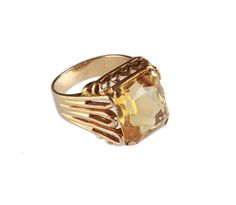 An exquisite vintage ring with a large rectangular faceted cut citrine mounted onto a very stylish setting and a yellow gold band. Citrine: Lovely vibrant and translucent yellow stone. Measures 14.1 x 11.7 mm and 7.9  mm in height with an estimated weight of 9.01 carats. The band is stamped 9CT for solid 9 carat (9k) gold. Finger Size: 7.25 (US), O1/2 (UK & Australia) Please select the resizing option before checking out. This process would normally take up to 14 days to complete. Please note that if you decide to return your ring after it has been resized we will deduct the resizing cost from your refund. Ring Weight: 8.8 grams This ring is in excellent vintage condition. This ring will be delivered to you in a nice new or vintage ring box. Please let us know if you would like a Certifica Formal Yellow Gold Topaz Ring With Rectangular Stone, Elegant Citrine Signet Ring For Formal Occasions, Elegant Formal Citrine Signet Ring, Elegant Yellow Hallmarked Signet Ring, Yellow Citrine Topaz Ring Rectangular Shape, Yellow Rectangular Gemstone Rings, Classic Yellow Rectangular Rings, Formal Yellow Rectangular Rings, Vintage Gold Faceted Rings