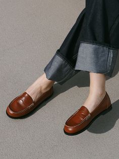 Editor's NotesMOL:pin presents sophisticated footwear that gives off a stylish mood.- Soft and glossy surface loafer- Thick and durable stitch line- Basic and simple loafer design- Soft and durable sheep leather usedMeasurements(in.)- Size: KR 225MM - KR 255MM (US 5.5 - 8.5)- Heel Height: 0.39 in.Composition & Care- Upper: Sheep Leather  Lining: Pig Skin- Natural leather may have fine scratches and wrinkles- Bright leather can get stained by denim or dark outfits- Pen and bond marks may occu Fall Loafers With Brogue Detailing And Round Toe, Brogue Detail Slip-on Loafers For Work, Flat Slip-ons With Brogue Detailing For Work, Fall Almond Toe Loafers With Brogue Detailing, Fall Brogue Detailing Closed Toe Moccasins, Brown Textured Sole Slip-ons For Office, Fall Moccasins With Brogue Detailing And Closed Toe, Brown Rubber Sole Platform Loafers For Office, Brown Platform Loafers With Rubber Sole For Office