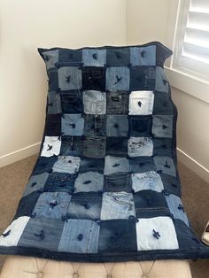 a bed made out of jeans in a room