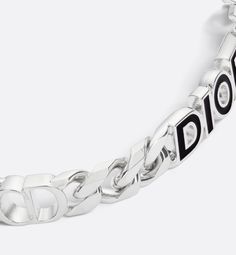 The bracelet is a graphic creation that combines simplicity and modernity. The silver-finish brass chain links showcase the Dior Italic signature adorned with black resin. Openwork CD Icon details embellish the piece. The bracelet can be worn with the necklace and ring to complete the look.. Designer Metal Chain Bracelets, Black Sterling Silver Chain Bracelet, Modern Silver Chain Bracelet, Designer Black Metal Jewelry, Designer Silver Chain Jewelry, Designer Silver Chain Bracelets, Luxury Metal Bracelets With Black Enamel, Modern Silver Chain Bracelets, Luxury Black Enamel Metal Bracelets