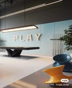 a pool table in the middle of a room with chairs around it and a sign that says play