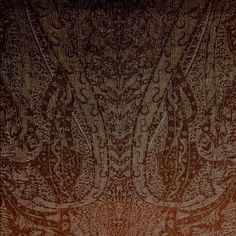 an orange and brown wallpaper with intricate designs on it's edges, in shades of red