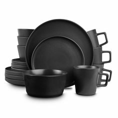 black dinnerware set with cups and saucers in front of white backgroud