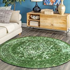 a living room with blue walls and green rug