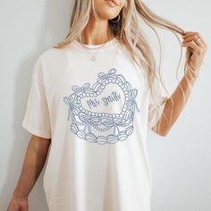 Get ready to say I do in style with our Custom Bride shirt! ️  This shirt is ideal for bridal showers, bachelorette parties, or just showing off your excitement for the upcoming big day! Grab yours today and let the countdown to happily ever after begin! 💕 Comfort Colors Garment Dyed 1717 Unisex T Shirt Relaxed fit, please check the size chart in photos to ensure the correct size.  100% Ring Spun Cotton Pre-Shrunk Fabric for size retention Care Instructions:  Machine wash cold inside out, Tumbl Bridal Tshirts Design, Bride Tshirt Ideas, Bridal Party Tshirts, Blue Coquette, Bow Cake, Bride Tshirt, Cake Custom, Bow Cakes, Mrs Shirt