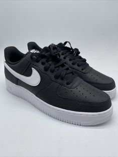 Elevate your sneaker game with these Nike Air Force 1 Low Top sneakers. The stylish black and white design, featuring a colorful theme, is perfect for any athletic occasion. Made with high-quality leather and CT2302-002 style code, these sneakers are sure to impress. The sizes 11-16 fit is perfect for men who want to make a statement with their footwear. Whether you're hitting the gym or just running errands, these Nike Air Force 1 sneakers are the perfect addition to your shoe collection. Don't miss out on this must-have sneaker release from 2021. Nike Air Force 1 Black, Air Force 1 Sneakers, Sneaker Release, Nike Air Force 1 Low, Sneaker Games, Air Force 1 Low, Low Top Sneakers, Black And White Design, Nike Air Force 1