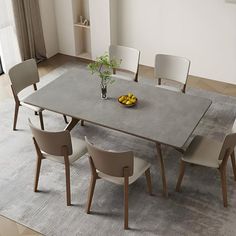 a dining room table with chairs around it