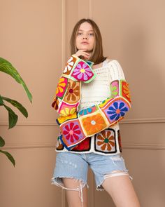 Every stitch I weave into this colorful flowers sweater is an expression of my boundless devotion, affection, and attentiveness. ❤️ This handmade knitted crop top is an amazing for beautiful women. It will perfectly fit with your jeans, shorts. Especially you could combine it with long boho skirts... Also you can wear it in summer on the beach or party. Model size information:  167 cm / 5.47 Feet  / 66 kg  Chest: 95 cm /  37.40 inch Please write your bust measurements and I will prepare your mea Retro Multicolor Sweater For Spring, Spring Crochet Acrylic Sweater, Multicolor Knit Sweater For Spring, Bohemian Acrylic Sweater For Spring, Spring Acrylic Crochet Sweater, Spring Bohemian Acrylic Sweater, Multicolor Patchwork Knit Sweater, Multicolor Knit Crochet Top For Fall, Fall Multicolor Crochet Knit Top