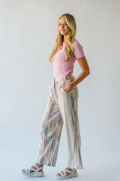 Introducing the Feia Embroidered Pant, perfect for adding some quirky style to your wardrobe. With colorful embroidery and a cream base, these pants are sure to make a statement. Step out in style while staying comfortable and unique. Details self: 61% acrylic + 22% polyester + 17% viscose lining: 100% cotton Fabric Care Guide Here Sizing & Fit Measurements are approximate and taken while laying flat across the front. Not doubled. small: waist = 15"; length = 42" ; inseam= 30" medium: waist = 15 Trendy Floral Embroidered Wide Leg Bottoms, Trendy Wide Leg Bottoms With Floral Embroidery, Trendy Straight Leg Pants With Floral Embroidery, Multicolor High-waisted Cotton Pants, White Floral Embroidered Wide-leg Bottoms, Beige Floral Embroidered Pants For Spring, Summer Cream Bottoms With Floral Embroidery, White Wide-leg Pants With Floral Embroidery, Cream Floral Embroidery Bottoms For Summer