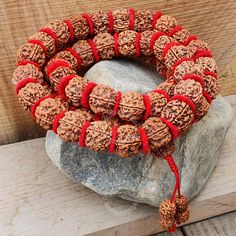 🌟 Embrace Spiritual Serenity with Our Nepali 5 Mukhi Rudraksha Kantha Mala Necklace in Buddhist Style! 📿 Infused with the essence of ancient Buddhist wisdom, our Nepali 5 Mukhi Rudraksha Kantha Mala Necklace is a sacred accessory meticulously crafted to enrich your spiritual practice. Available in 32, 54, or 108 beads, each Rudraksha bead is a conduit for divine energy, offering a myriad of benefits and properties deeply rooted in Buddhist tradition. ✨ MALA DETAILS ✨ 🪔 5 Mukhi Rudraksha Nepal Traditional Handmade Mala For Meditation, Handmade Spiritual Mala For Rituals, Bohemian Hand-strung Mala For Rituals, Spiritual Necklaces With 108 Beads For Rituals, Traditional Red Bracelets For Meditation, Traditional 108 Beads Bracelet For Festivals, Handmade Traditional Mala For Rituals, Traditional Bracelets With 108 Beads For Festivals, Spiritual Beaded Bracelets For Festivals