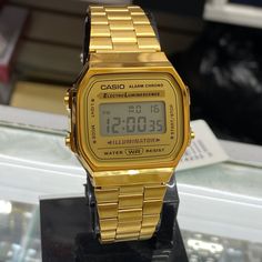 Casio Classic Style Watch Stainless Steel Brand New Item Unisex. Size 34mm Diameter Goldtone Color Classic Digital Watch With Rectangular Dial And Date Display, Gold Digital Watch With Subdials, Classic Gold Chronograph Watch With Date Display, Classic Gold Stopwatch Watch Accessories, Classic Gold Watch Accessories With Stopwatch, Gold Digital Watch With Stopwatch, Classic Gold Chronograph Digital Watch, Classic Gold Watch With Analog Display, Gold Watch Accessories With Rectangular Analog Dial