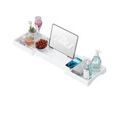 a white tray with bottles and other items on it