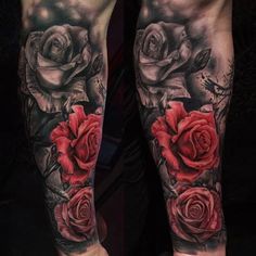 tattoos on both legs with roses and leaves