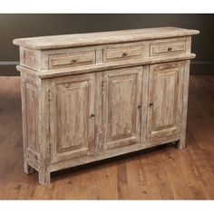 an old white wooden cabinet with drawers on the bottom and two doors at the top