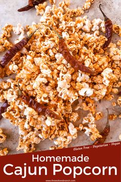 homemade cajun popcorn with chili peppers on top and the title overlay reads homemade cajun popcorn