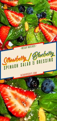 a salad with spinach, strawberries and blueberries on it is shown in front of a sign