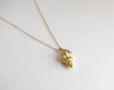 "A gorgeous matte Gold Vermeil seashell necklace. - Pendant - Gold Vermeil - Chain + components - - Clasp - . . . . . . . . . . . . . . . . . . . . . . . . . . . . . . . . GOLD VERMEIL Gold vermeil pieces consist of a combination of previous metals, most often .925 sterling silver covered in a layer of Gold 10K or higher. These metals are fused together creating a lovely, durable and affordable alternative to solid gold that, with care, will last for years to come. . . . . . . . . . . . . . . . Pendant Necklace Outfit, Gold Seashell Necklace, Pendant Necklace Simple, Beach Necklaces, Seashell Necklace, Jewelry Accessories Ideas, Classy Jewelry, Jewelry Lookbook, Shell Pendant