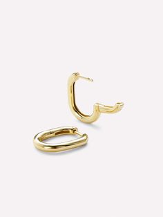 Make a statement of minimalism with these dainty gold hoop earrings crafted in 100% recycled sterling silver and dipped in 14k gold. These hoop earrings are also available in a smaller size. Lightweight and versatile, these gold hoop earrings are perfect to wear alone for a smart-chic look or stacked with other hoops for a rock-glam vibe.  Sterling silver hoops dipped in 14k gold Lightweight, hypoallergenic & versatile  Contemporary design & comes with a 365-day warranty Minimalist Recycled Gold Huggie Earrings, Everyday Recycled Gold Huggie Earrings, Everyday Single Earring In Recycled Gold, Modern Recycled Gold Hoop Earrings For Everyday, Everyday Yellow Gold Hoop Earrings From Recycled Gold, Modern Yellow Gold Huggie Earrings For Everyday, Everyday Yellow Gold Hoop Earrings In Recycled Gold, Everyday Yellow Gold Recycled Hoop Earrings, Minimalist Gold Plated Hoop Earrings With Polished Finish