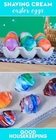 three different colored eggs sitting on top of a table next to a basket filled with candy