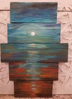 an art piece made out of wood and painted with acrylic paint