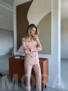 2-piece Womens Blazer Trouser Suit for office, business meetings, formal events and special occasions. Also perfectly combines with sneakers so after a long and tiring business day you can change you heels to sneakers and still look chic. DETAILS -  slim fit  -  cropped  -  high rise pants with belt loops -  blazer is buttoned -  lined MATERIAL Premium quality suiting fabric, which consists of viscose mostly and a bit of polyester and elastane SIZES The model's wearing a size XS (0 US numeric) A Professional Double Breasted Suit For Office, Professional Double Breasted Suit For Work, Professional Business Casual Pantsuit, Professional Double Breasted Suit For Business Casual, Spring Business Casual Office Lady Pantsuit, Tailored Professional Pantsuit For Business Meetings, Professional Spring Suits For Office Wear, Professional Spring Office Wear Pantsuit, Professional Suits For Office In Spring