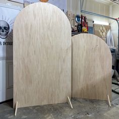 two unfinished wooden boards sitting next to each other