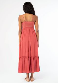 A timeless bohemian maxi dress you'll be reaching for all season. Designed in a flowy crinkle gauze, this effortless dress features a slim-fit smocked bodice with contrast thread detail, adjustable spaghetti straps, and must-have side pockets. Crinkle gauze Slim fit smocked bust Flowy skirt Sleeveless Maxi length Ruffle-trimmed tiered skirt Straight neckline Contrast thread detail Button front Adjustable spaghetti straps Side pockets Flowy bohemian maxi dress Model is 5'9, wearing a size S.Style Brunch Maxi Dress With Smocked Back And Flowy Skirt, Maxi Length Dresses With Smocked Back And Flowy Skirt, Beach Midi Dress With Ruched Bodice, Vacation Midi Maxi Dress With Ruched Bodice, Empire Waist Ruched Bodice Sundress, Flowy Maxi Dress With Smocked Back, Rayon Midi Dress With Smocked Back, Empire Waist Sundress With Ruched Bodice, Maxi Dress With Smocked Back And Flowy Skirt