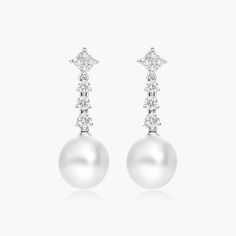 These elegant earrings feature beautiful pearls and twinkling diamonds. The perfect addition to any jewelry collection, these earrings give a luxurious and timeless feel. Modern White Bridal Earrings For Formal Occasions, Exquisite White Gold Pearl Earrings, Luxury White Diamond Earrings With Pearls, Luxury White Gold Pearl Earrings, Luxury Pearl Diamond Earrings, Luxury Pearl Diamond Drop Earrings, Luxury White Gold Drop Pearl Earrings, Luxury White Pearl Earrings With Diamond Accents, Luxury Gold Plated White Pearl Earrings