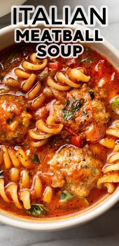 italian meatball soup in a white bowl on a marble counter top with the title above it