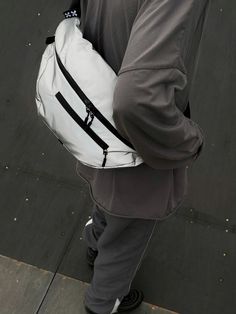 a man with a white backpack on his back